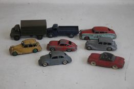 A COLLECTION OF EIGHT UNBOXED DINKY VEHICLES to include 3 ton army truck, Hudson sedan, Austin
