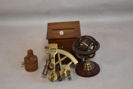 A REPRODUCTION BRASS SEXTANT, ALONG WITH A MINIATURE ZODIAC GLOBE, wooden tape measure & cigarette