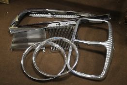 DAMILER INTEREST, A QUANTITY OF VINTAGE PARTS, to include a grill (A/F) various body & wheel