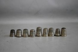 TEN SILVER AND WHITE METAL THIMBLES