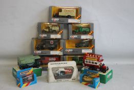 NINE CORGI TRUCKS/BUSES plus two Matchbox cars and one Matchbox truck.
