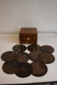 A WALNUT CASED POLYTHON DISC PLAYER AND A QUANTITY OF DISCS, lever wound mechanism, incised flower