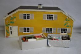 A 1970s LUNDBY DOLLS HOUSE, with two boxes of furniture and small dolls etc.