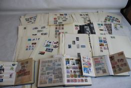 A COLLECTION OF BRITISH STAMPS TO SHEETS, AND IN ALBUMS, to include a small album of stamps