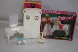 A BOXED SINDY WARDROBE together with a boxed Barbie Doll's Dream Horse Dixie baby palomino, and a