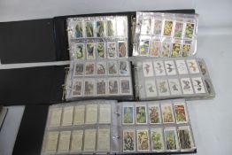 SIX ALBUMS OF COLLECTORS CARDS COMPLETE AND INCOMPLETE SETS by Ogdens, WD & HO Wills, Churchman,