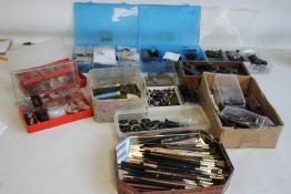 A BOX OF OO GAUGE SPARE PARTS, tools, brushes etc.