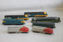 A SELECTION OF FIVE UNBOXED LOCOMOTIVES - three Hornby, one Lima and one Santa Fe Set.