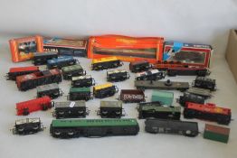 CIRCA THIRTY PIECES OF ROLLING STOCK, BOTH COVERED AND UNCOVERED to include wagons, mainly Hornby