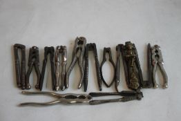 A COLLECTION OF ANTIQUE NUT CRACKERS, to include a pair with Lincoln Imp design