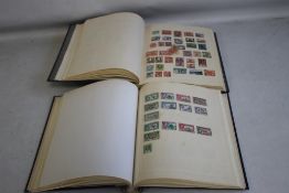 TWO ALBUMS OF BRITISH COMMONWEALTH STAMPS, to include a selection of Falkland Islands, Dominica,