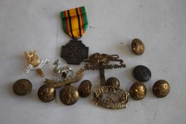 A BELGIUM MILITARY COMBATANTS CROSS MEDAL 1940-45 and a quantity of military badges and buttons.