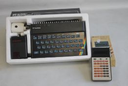 A BOXED SINCLAIR ZX SPECTRUM PERSONAL COMPUTER, together with a boxed vintage Rockwell Calculator