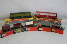 TWO BOXED LIFE LIKE 00 GAUGE BOX CARS 08992 AND ANOTHER, together with four boxed Trix Rolling Stock