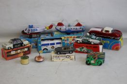 TEN TIN PLATE TOYS, to include Sky Patrol Helicopter, sports car, spinning top, etc