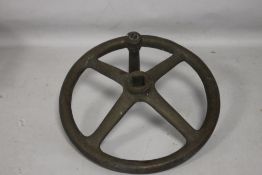 A BRASS/BRONZE FOUR SPOKE FLY WHEEL POSSIBLY FROM A WWI ARTILLERY PIECE D 30.5 cm