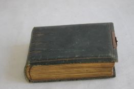 A VICTORIAN PHOTOGRAPH ALBUM, containing a selection of Portraits