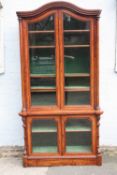 A QUALITY VICTORIAN MAHOGANY GLAZED BOOKCASE, the arched top above two shaped glazed doors, the