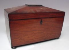 A 19TH CENTURY MAHOGANY SARCOPHAGUS SHAPED TEA CADDY, the hinged lid opening to a part fitted