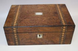 A 19TH CENTURY WALNUT INLAID DRESSING BOX, with mother of pearl panel to the lid, plain interior,