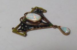 AN ARTS AND CRAFTS COPPER AND ENAMEL PENDANT, set with central oval opal and opal dropper, H 4.2 cm.