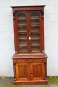 A 19TH CENTURY MAHOGANY GLAZED FLOORSTANDING BOOKCASE OF SLIM PROPORTIONS, the glazed, twin door