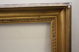 AN 18TH CENTURY GOLD FRAME WITH DECORATIVE DESIGN TO INNER EDGE, frame W 9 cm, frame rebate 77 x