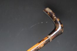 AN ANTIQUE TORTOISESHELL AND BAMBOO SWORD STICK, L 89 cm