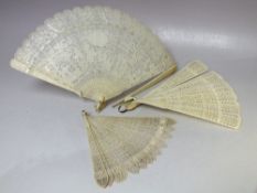 TWO BOXED ANTIQUE CARVED BONE / IVORY BRISE FANS FOR RESTORATION, together with an unboxed