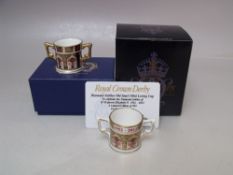 A LIMITED EDITION ROYAL CROWN DERBY DIAMOND JUBILEE OLD IMARI MINIATURE LOVING CUP, number 209 of