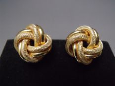 A PAIR OF 14K GOLD CLIP ON EARRINGS, in the form of a knot, marked to clip 14K, MILOR, Italy, approx