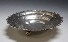 A CONTINENTAL SILVER FOOTED DISH, stamped 875 and raised on three ball feet, approx weight 405g, Dia