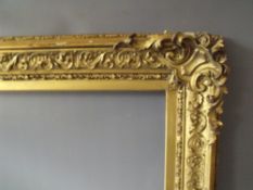 A 19TH CENTURY DECORATIVE GOLD FRAME WITH CORNER EMBELLISHMENTS, frame W 9 cm, frame rebate 72 x
