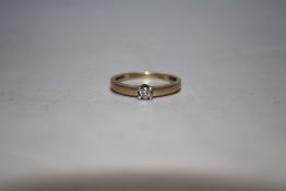 A 9 CARAT GOLD DIAMOND SOLITAIRE RING, ring size O 1/2