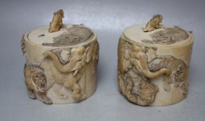A PAIR OF 19TH CENTURY CHINESE CARVED IVORY LOW POTS AND LIDS, each with carved decoration of