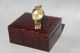 AN 18 CT GOLD OMEGA CONSTELLATION AUTOMATIC WRIST WATCH, coming with both inner and outer box,
