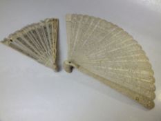 AN ANTIQUE CARVED BONE / IVORY BRISE FAN FOR RESTORATION, together with a smaller example, longest L