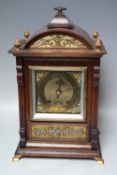 AN EARLY 20TH CENTURY OAK CASED MANTEL CLOCK BY LENZKIRCH, the architectural case with decorative