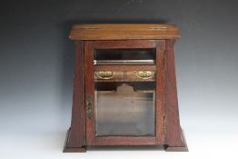 AN ARTS AND CRAFTS STYLE TOBACCO CABINET, H 34 cm