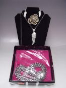 A SELECTION OF BUTLER AND WILSON FASHION JEWELLERY, to include a gold plated flower brooch with