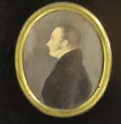 GEORGIAN OVAL SILHOUETTE OF A GENTLEMAN, unsigned, pen and ink on paper heightened in gold, framed