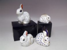 A COLLECTION OF FOUR ROYAL CROWN DERBY RABBIT PAPERWEIGHTS, comprising two boxes examples 'Snowy