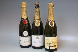 THREE ASSORTED OLD BOTTLES OF CHAMPAGNE TO INCLUDE 1 BOTTLE OF MOET & CHANDON WITH A JCB 1995