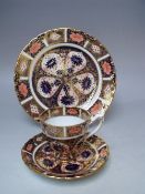 A ROYAL CROWN DERBY COFFEE CAN AND SAUCER, pattern no. 9310, together with a side plate - Dia. 18 cm