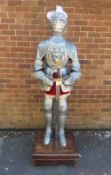 AN EMBOSSED STEEL CARLOS V FULL SIZE SUIT OF ARMOUR ON STAND, hand crafted in steel and iron, the