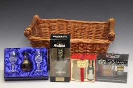 4 WHISKY MINIATURE GIFT PACKS TO INCLUDE LAGAVULIN 16 YEARS OLD, in a wicker basket