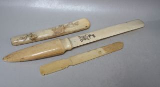 A 19TH CENTURY CHINESE IVORY PAGE TURNER, the blade with engraved 'MR' monogram and crest, L 38