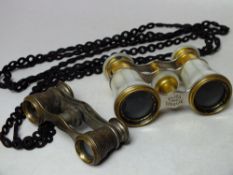 A PAIR OF LEMAIRE OF PARIS MOTHER OF PEARL OPERA GLASSES, together with a smaller pair of opera