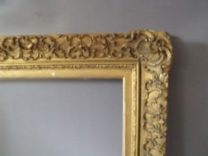 A 19TH CENTURY DECORATIVE GOLD FRAME WITH GOLD SLIP, frame W 5 cm, frame rebate 61 x 45 cm, slip