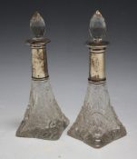 A PAIR OF HALLMARKED SILVER COLLARED SCENT BOTTLES - LONDON 1912, H 15.5 cm (2)